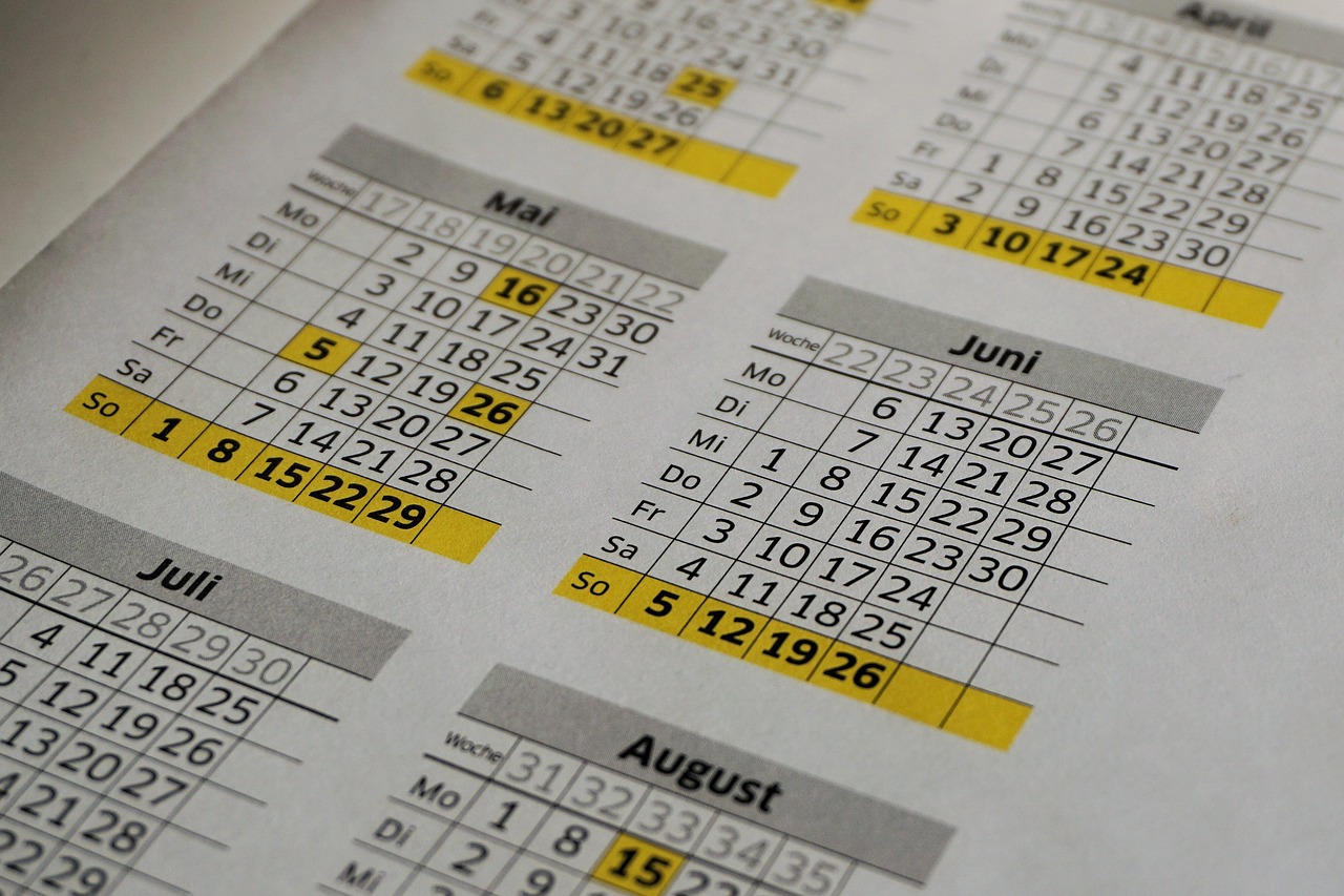 Annual wall calendar with handwritten event dates and planning notes visible across several months